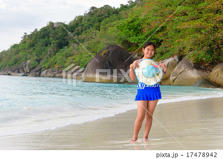 Girl on the beach at sunrise over the sea 17478942