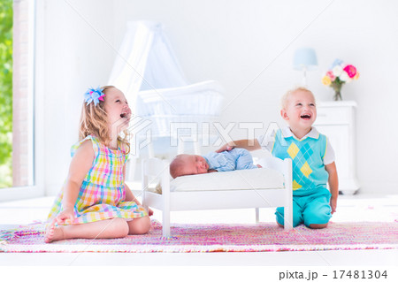 Kids playing with new born baby brother Kids playing with new born baby brother 17481304