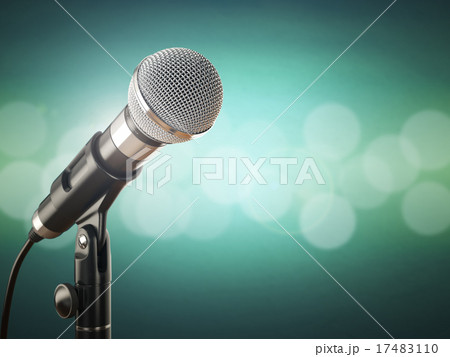 Microphone on the green abstract background. 17483110