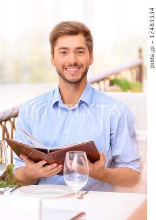 Loving couple looking through menu in the 17483334