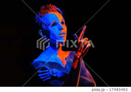 Portrait of a young man covered with neon paint Portrait of a young man covered with neon paint 17483463