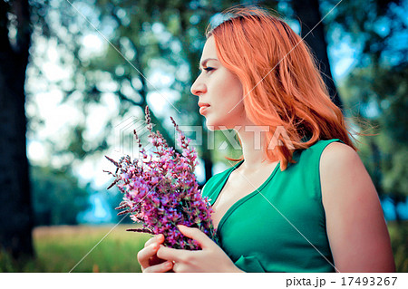 Romantic red-haired young woman in green long Romantic red-haired young woman in green long 17493267