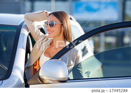 Attractive young businesswoman is resting near her Attractive young businesswoman is resting near her 17495286
