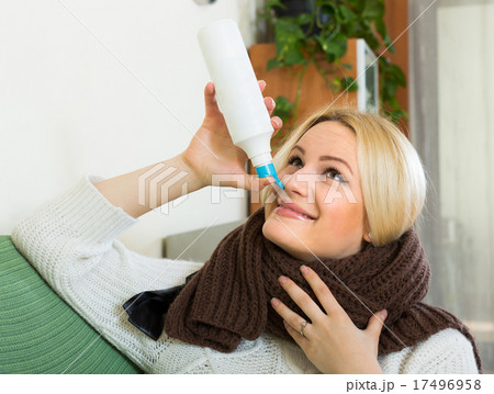 Young blonde with nasal spray 17496958