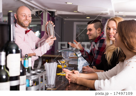 Group of young adults in bar Group of young adults in bar 17497109