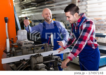 Two workmen in PVC shop Two workmen in PVC shop 17497148