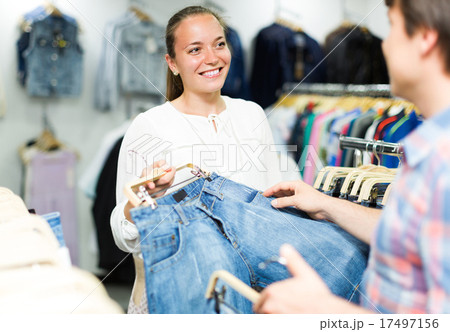 Couple buying blue jeans at store . Couple buying blue jeans at store . 17497156