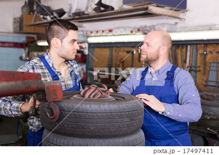 car mechanics working at carshop car mechanics working at carshop 17497411