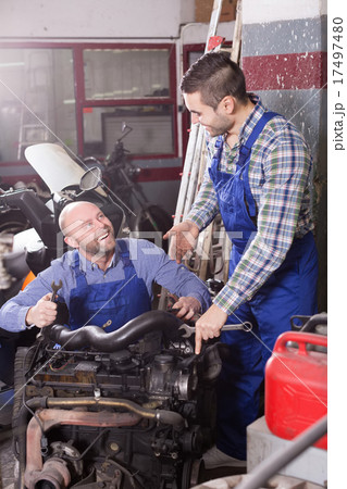 car mechanics working at carshop car mechanics working at carshop 17497480