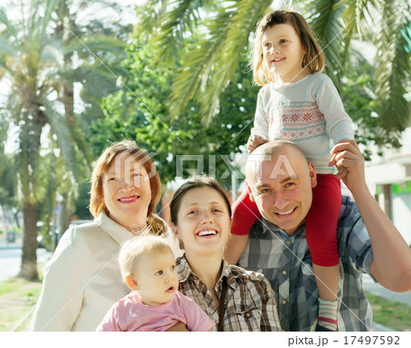 happy parents with children and grandmother 17497592