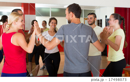 Group of people dancing salsa in studio Group of people dancing salsa in studio 17498073