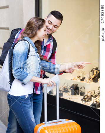couple of tourists choosing wristwatch couple of tourists choosing wristwatch 17498399