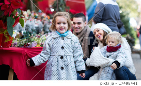 Family of four at Christmas market Family of four at Christmas market 17498441