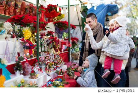 Family of four at Christmas market Family of four at Christmas market 17498588
