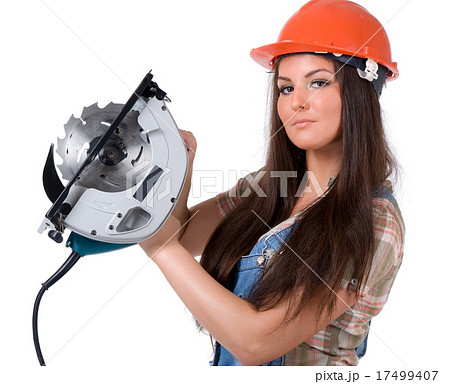 Young woman holding an electric circular disk saw. 17499407