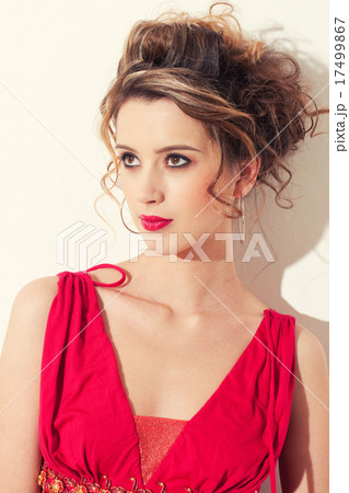 Close-up of beautiful girl with red vogue maekeup Close-up of beautiful girl with red vogue maekeup 17499867