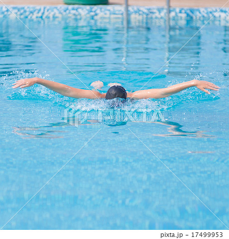 Young girl swimming butterfly stroke style Young girl swimming butterfly stroke style 17499953