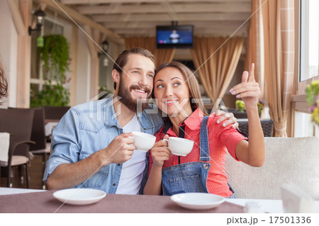 Handsome man and pretty woman in cafeteria Handsome man and pretty woman in cafeteria 17501336