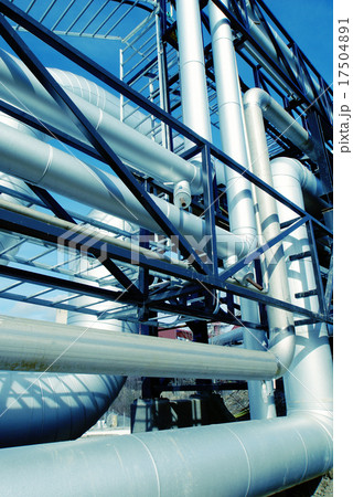IndustrialSteel pipelines valves against blue sky 17504891
