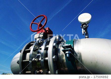IndustrialSteel pipelines valves against blue sky 17504892