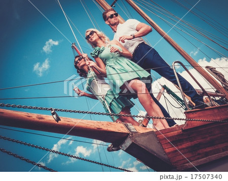 Stylish wealthy friends having fun on a luxury yacht 17507340