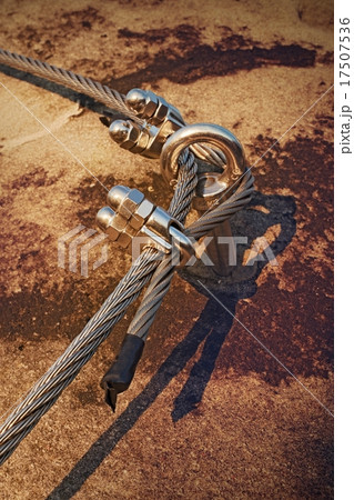 Eye bolt anchored in climber rock. The fixed rope Eye bolt anchored in climber rock. The fixed rope 17507536