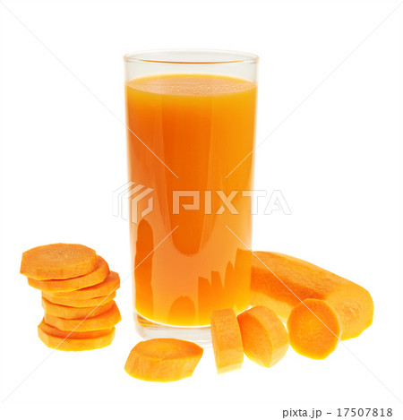 Sliced carrot pieces next to a juice bottle 17507818