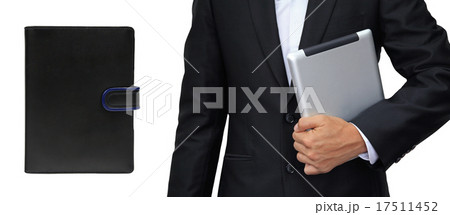 Business man holding tablet vs. organizer book  17511452