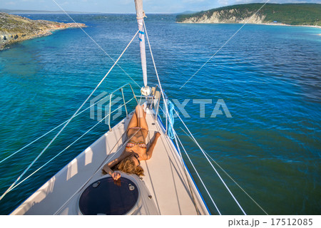 Beautiful girl sunbathing on the yacht. Beautiful girl sunbathing on the yacht. 17512085