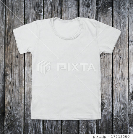 White blank t-shirt on dark wood desk White blank t-shirt on dark wood desk 17512560