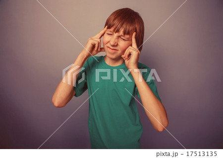 European-looking  boy of  ten years  holding an 17513135