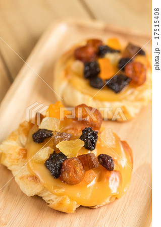 Danish custard with mixed dried fruit on wooden dish 17515408