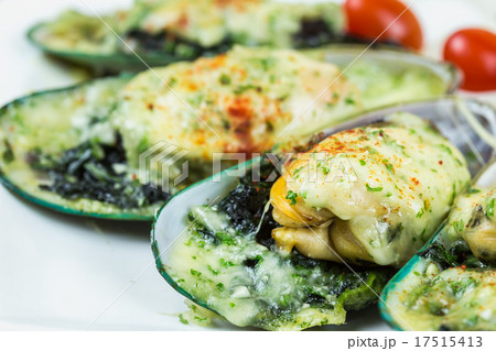 Mussels under cheese on wooden table 17515413
