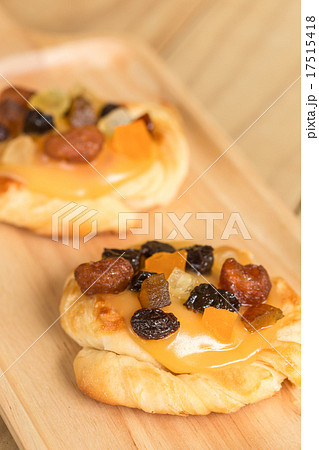 Danish custard with mixed dried fruit on wooden dish 17515418