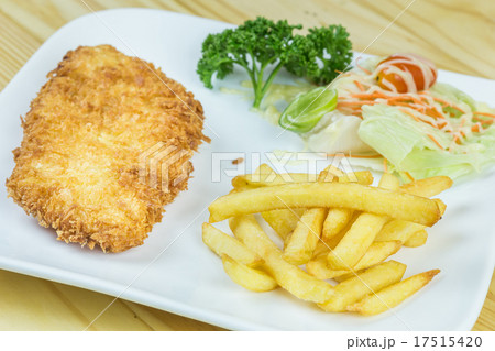 Fried Pork, French fries and vegetables Fried Pork, French fries and vegetables 17515420