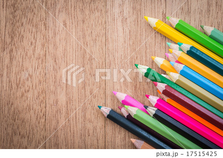 Stack colour pencils on wooden background Stack colour pencils on wooden background 17515425