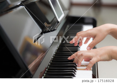 Close up of woman hands playing piano 17516028