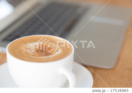 laptop with coffee cup on old wooden table ( Filtered image proc laptop with coffee cup on old wooden table ( Filtered image proc 17516065