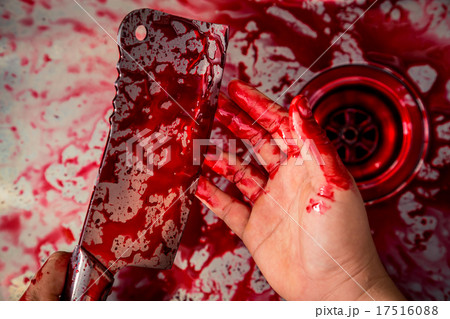 Hand hold bloody knife in a steel shell for halloween 17516088