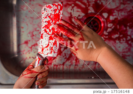 Hand hold bloody knife in a steel shell for halloween 17516148