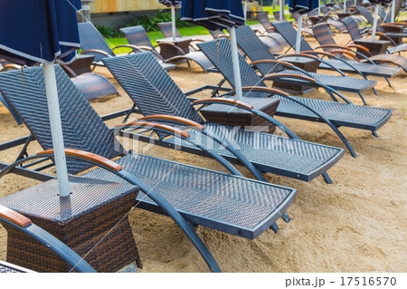 Beach chairs and umbrella on sand beach Beach chairs and umbrella on sand beach 17516570