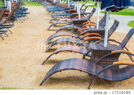 Beach chairs and umbrella on sand beach 17516580