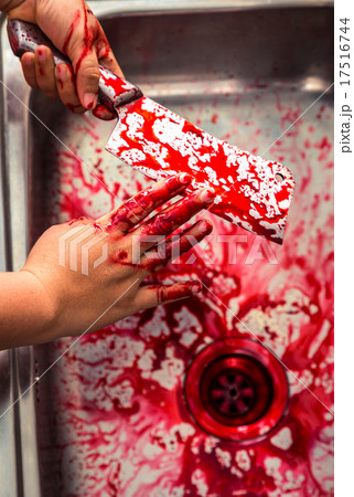 Hand hold bloody knife in a steel shell for halloween Hand hold bloody knife in a steel shell for halloween 17516744