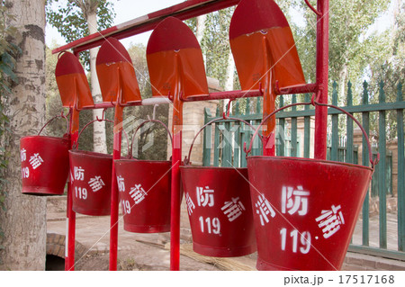 Red waterbuckets and shovels 17517168