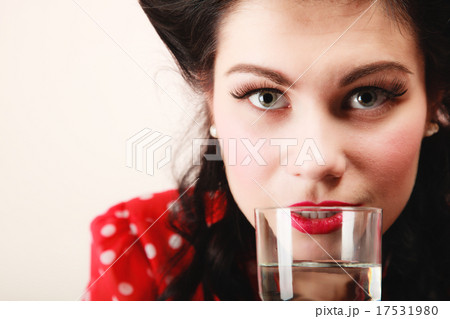 Retro. Pinup girl with glass of water drink Retro. Pinup girl with glass of water drink 17531980