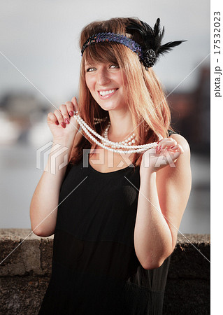 Flapper girl woman in1920s style portrait outdoor 17532023