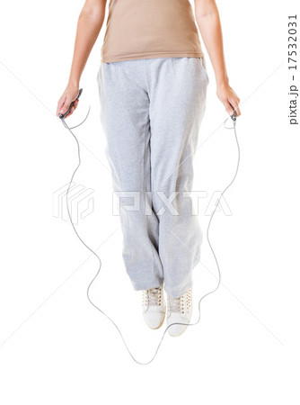 sporty girl plus size doing exercise with jump rope. sporty girl plus size doing exercise with jump rope. 17532031