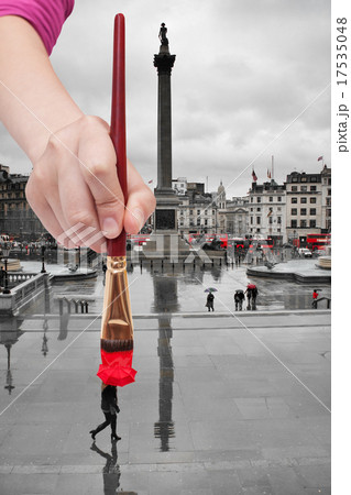 paintbrush paints red umbrella in London 17535048