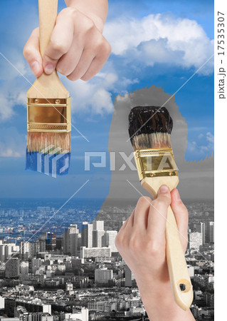 paintbrush paints black and blue side of city 17535307