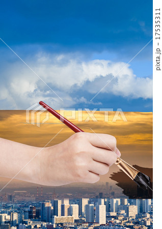 paintbrush paints smog sky over blue city 17535311